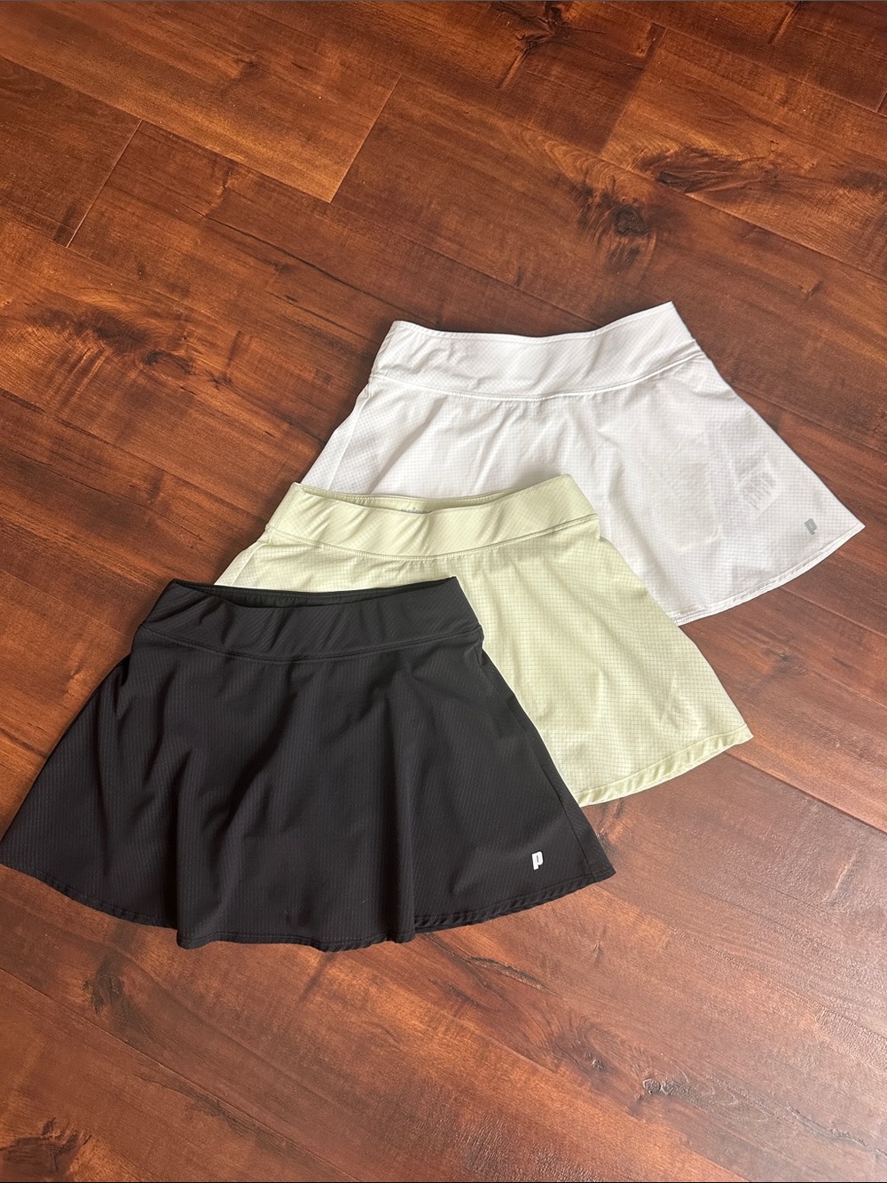 Prince Three-Pack Tennis Skirts in Black, Light Green, White, Girls M (10-12)